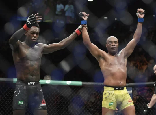 Reigning UFC champion Israel Adesanya (L) and Anderson Silva are the two greatest middleweights in MMA history. Adesanya defends his title Saturday in Sydney, Australia, against Sean Strickland in the main event of UFC 293. (Andy Brownbill/The Associated Press)